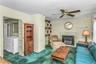 Spacious Family Room with faux fireplace and a beautiful view with access to the oversized backyard