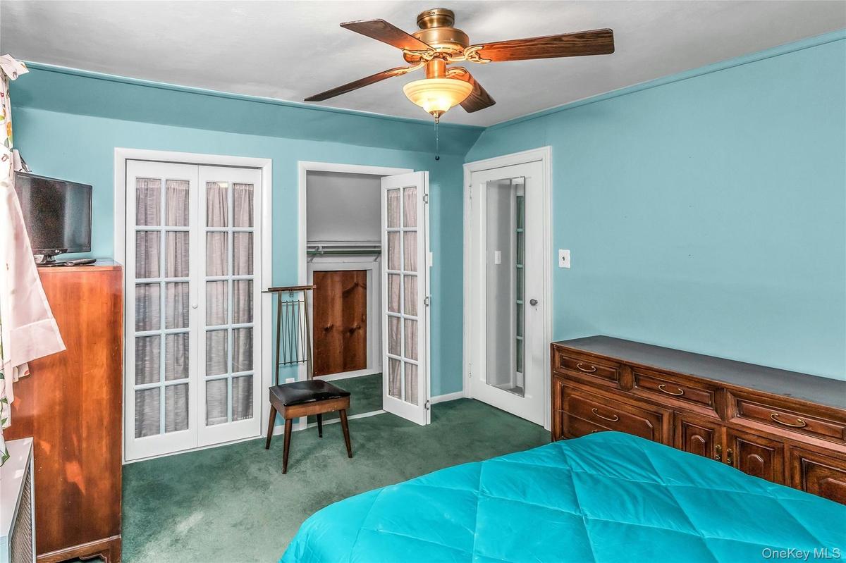 Primary Bedroom located on the second floor with large closets and access to crawl space