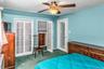 Primary Bedroom located on the second floor with large closets and access to crawl space