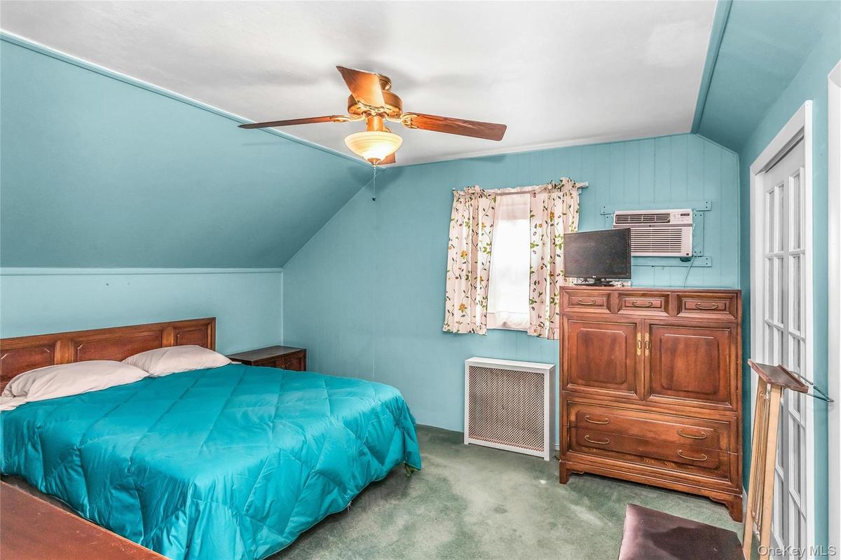 Primary Bedroom located on the second floor with large closets and access to crawl space