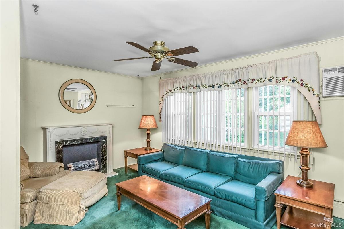 Spacious Family Room with faux fireplace and a beautiful view with access to the oversized backyard