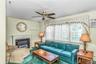 Spacious Family Room with faux fireplace and a beautiful view with access to the oversized backyard