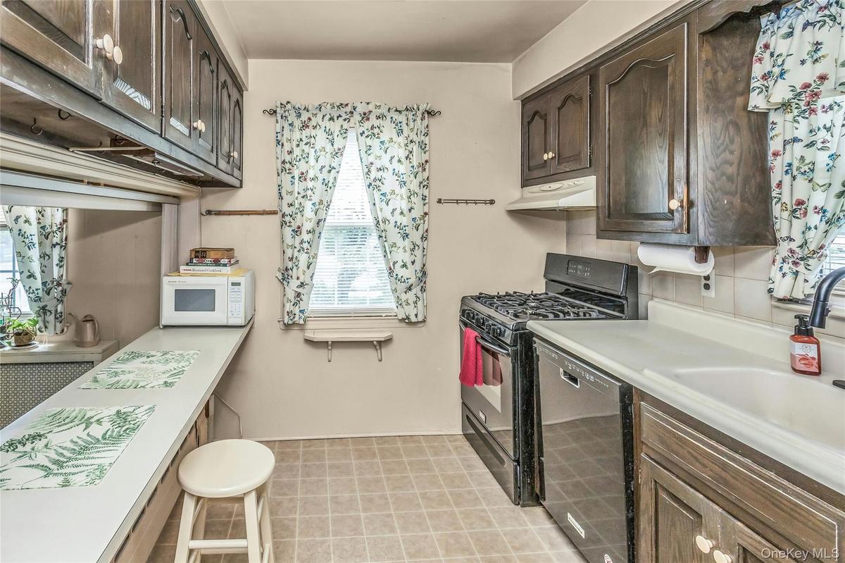 Open Galley Kitchen with Breakfast Bar and open access to Living Room