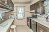 Open Galley Kitchen with Breakfast Bar and open access to Living Room