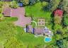 Aerial View showing 3 Car Garage and Green House