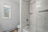 Tiled soaking tub.
