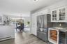 Doble door GE refrigerator, under counter storage baskets, wine cooler.