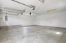 2 car garage. Staged empty for your imagination. Fully insulated. Electric charging station.