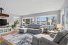 Living rooms flows into dining room.