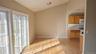 Dining Room open to living room and kitchen with French door style slider to balcony