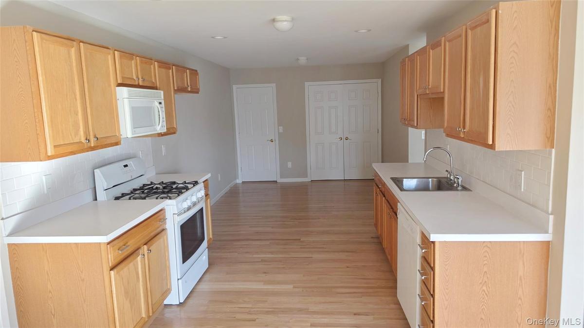 Kitchen with dining area, pantry and laundry closet