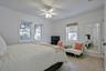 Bright interior featuring tiled flooring and white walls