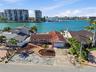 Drone shot of existing structure on 4 Bellevue Dr looking south at The Devil's Elbow on the Intracoastal and the one bridge to the Gulf in the foregro