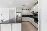 Beautiful kitchen with a large island, upgraded finishes, and plenty of workspace.