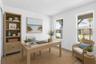 Virtually staged first level bedroom can be used as flex space showing how easily this room can live as an office, reading room, or creative retreat.