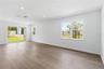 Open gathering room with natural light and flexible space for everyday living.