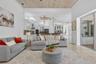 Great room to kitchen, lanai and pool past slider on the right