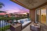 Virtually staged; Enjoy endless hours of sunset and sunrise views on Covered Terrace.  Note retractable roll-down screen feature.