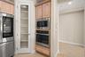 Beautiful appliances in the Kitchen and just-the-right-size pantry closet.