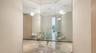 Half bathroom positioned just off the open-concept great room and circular kitchen