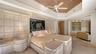 1st Floor Primary suite seamlessly opens to an adjoining lounging area, creating a private retreat