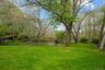 Backyard with fire pit patio overlooking the pond