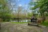 Custom Fire pit stone patio overlooking the pond