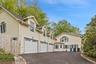 Driveway featuring 3 car garage