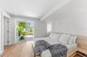 The backyard greenery seems to be reaching into the rooms in a subtle way, which makes them true Garden Suite bedrooms.