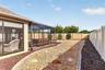 Low-Maintenance Stoned Landscaping with Privacy Wall