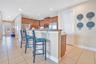 Open-concept living space with seamless flow to dining and kitchen—ideal for entertaining larger groups.