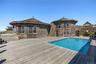Facing the Home from the corner of the deck with the Atlantic Ocean at your back
