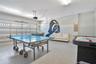 Immersive recreation space featuring ping pong and interactive gaming zones