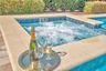 Relaxing spa feature overlooking the pool -perfect for evening enjoyment after a day at the parks.