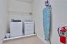 Convenient upstairs laundry room providing added functionality for large groups and extended stays