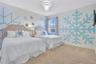 Whimsical FROZEN inspired suite featuring twin beds and enchanting snowflake décor