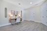 Spacious upper-level loft offering additional gathering or workspace flexibility