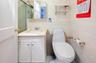 Full bath with vanity and tile walls