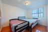 Bedroom with radiator and wood finished floors