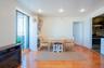 Dining space with light wood finished floors and a glass covered fireplace