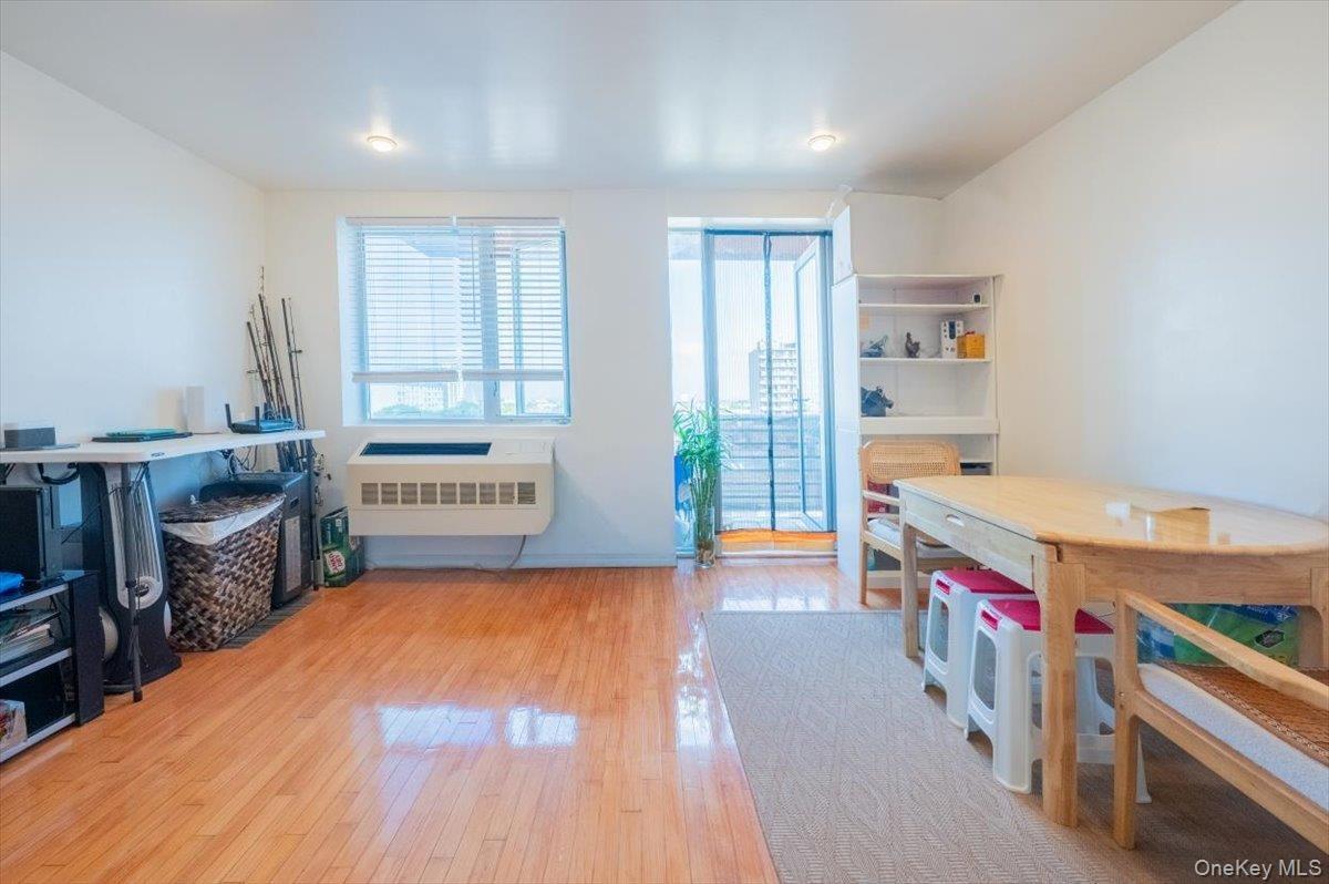 Rec room featuring radiator heating unit and light wood finished floors