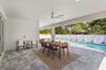 Behind the white pillow chairs the wall is pre-plumbed for an outdoor kitchen.
