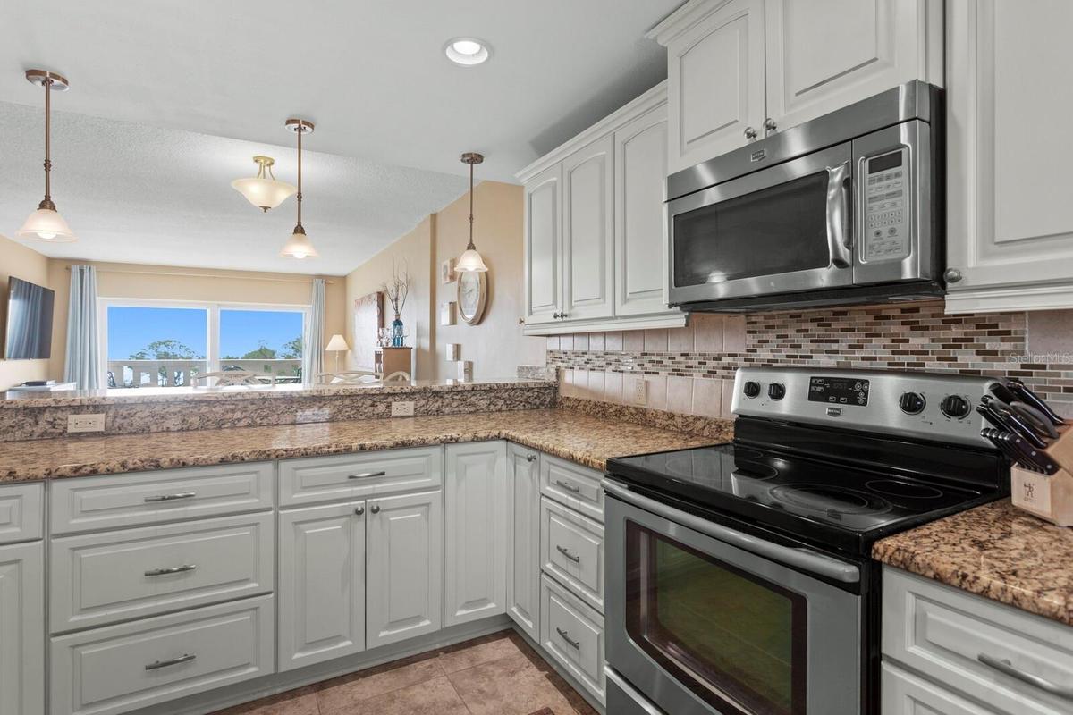 Kitchen w/ceramic tile flooring.