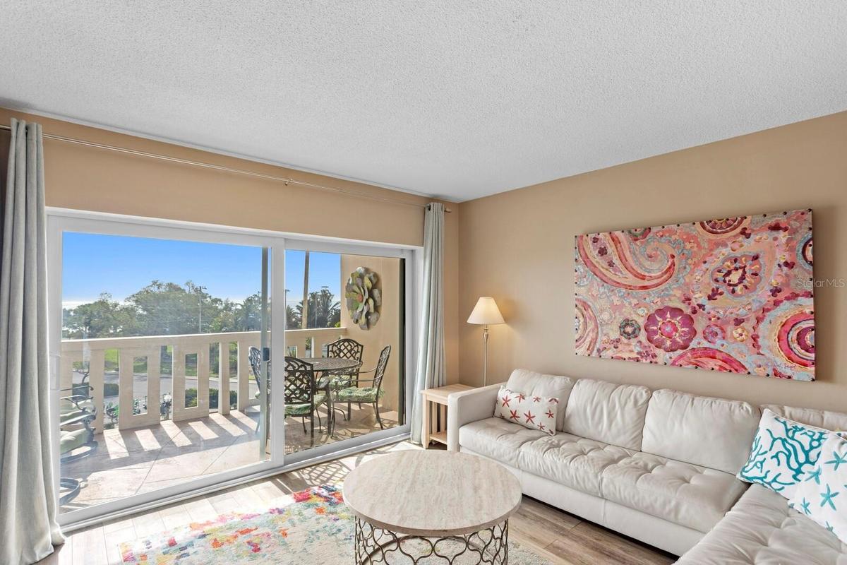 Living area view of patio; hurricane sliders
