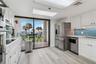 Updated kitchen. Quartz countertops, stainless steel appliances, plenty of cabinet space.