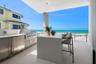 Enjoy the Summer kitchen with Coyote™ gas grill, refridgerator and sink.