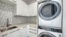 Second floor laundry room has full size washer & dryer