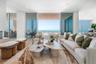 Open living space features a vapor fireplace, opening to the 40 foot terrace