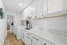 Inside laundry room with great storage