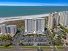 Aerial showing other similar residential properties along the beach